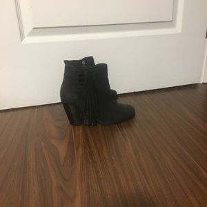 Black booties with fringe